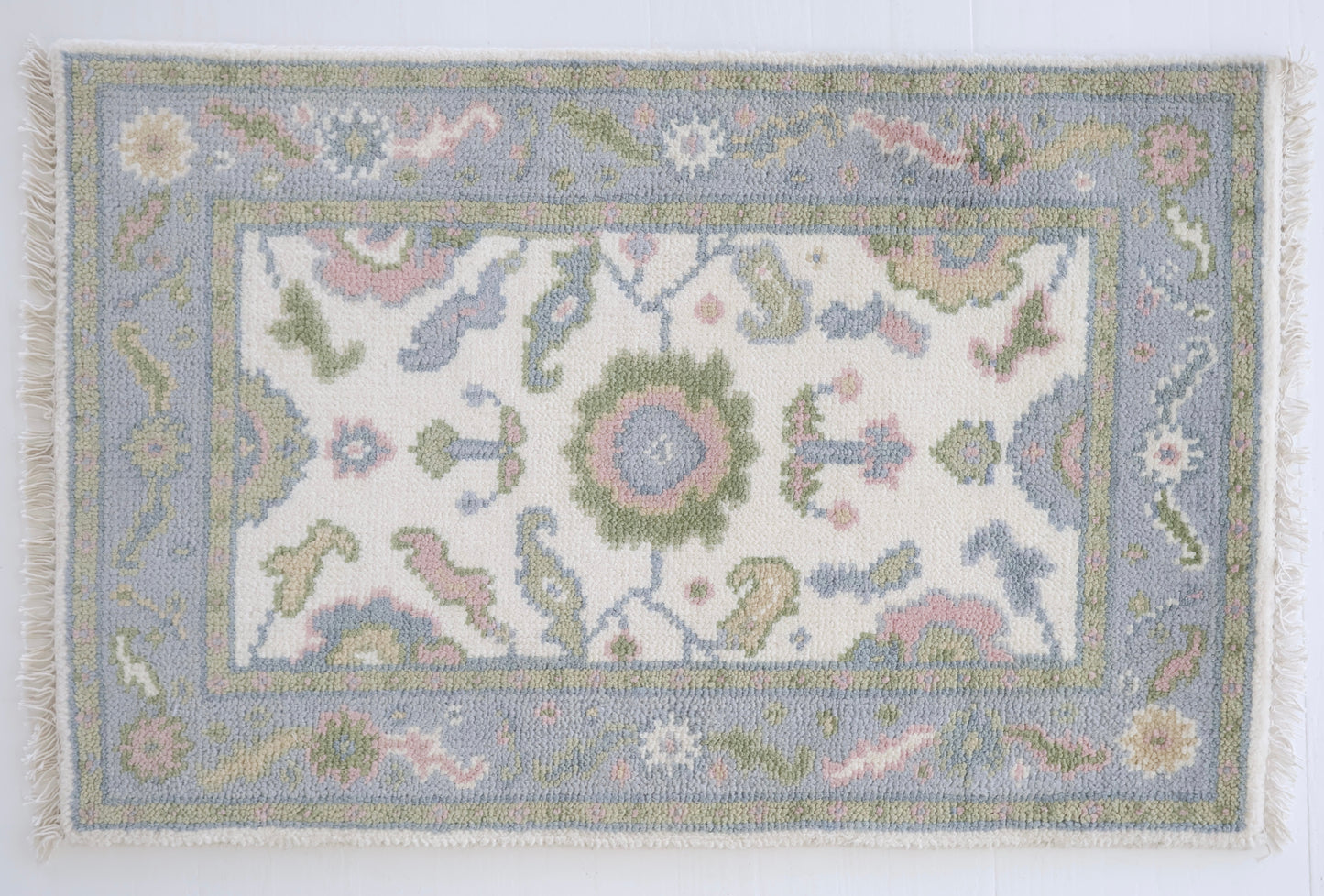 Decorative Riley rug with intricate patterns on a white background