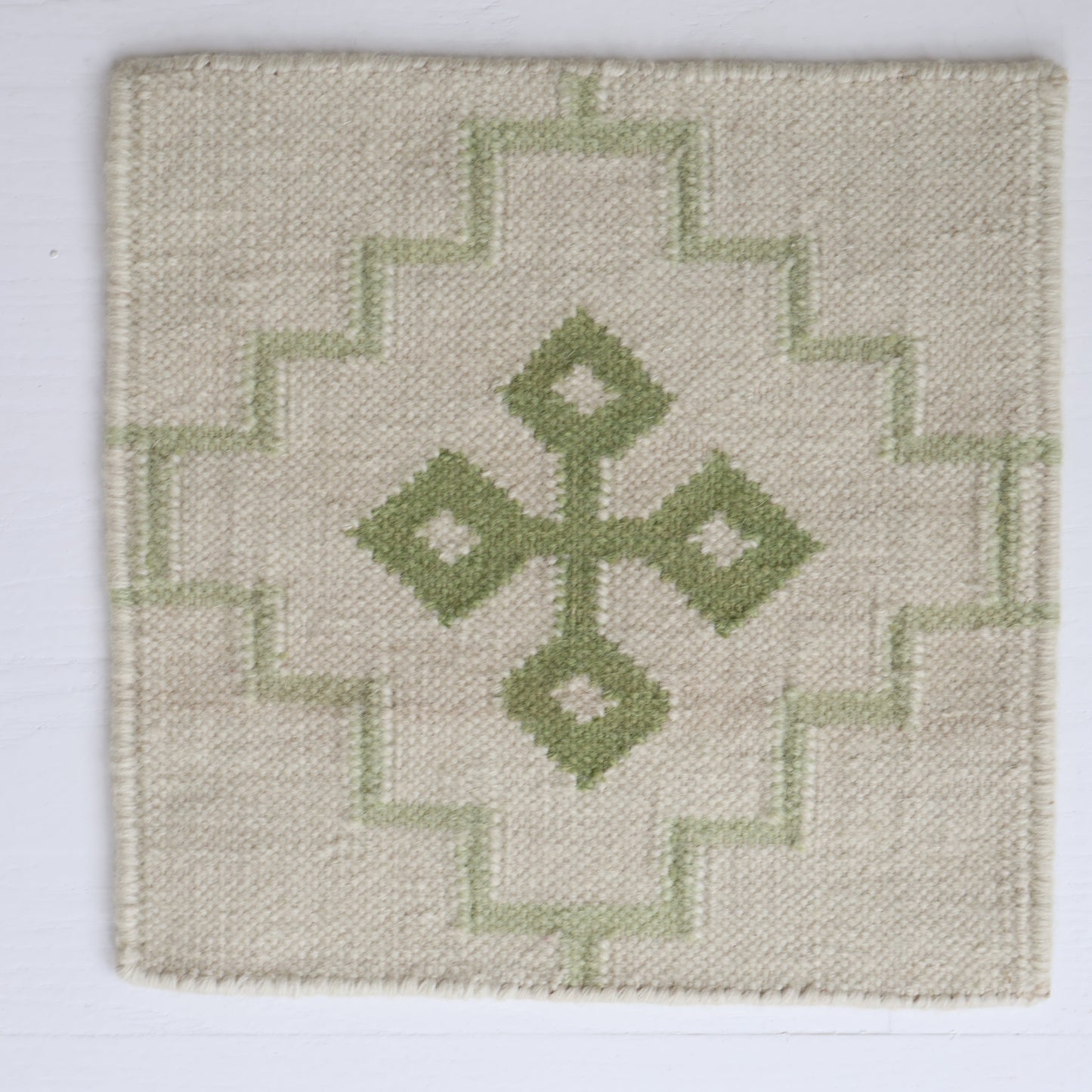 Handwoven wool rug sample in pistachio green and cream geometric cross pattern – Pistachio Green Flatweave Sample by Locust Lane Rugs