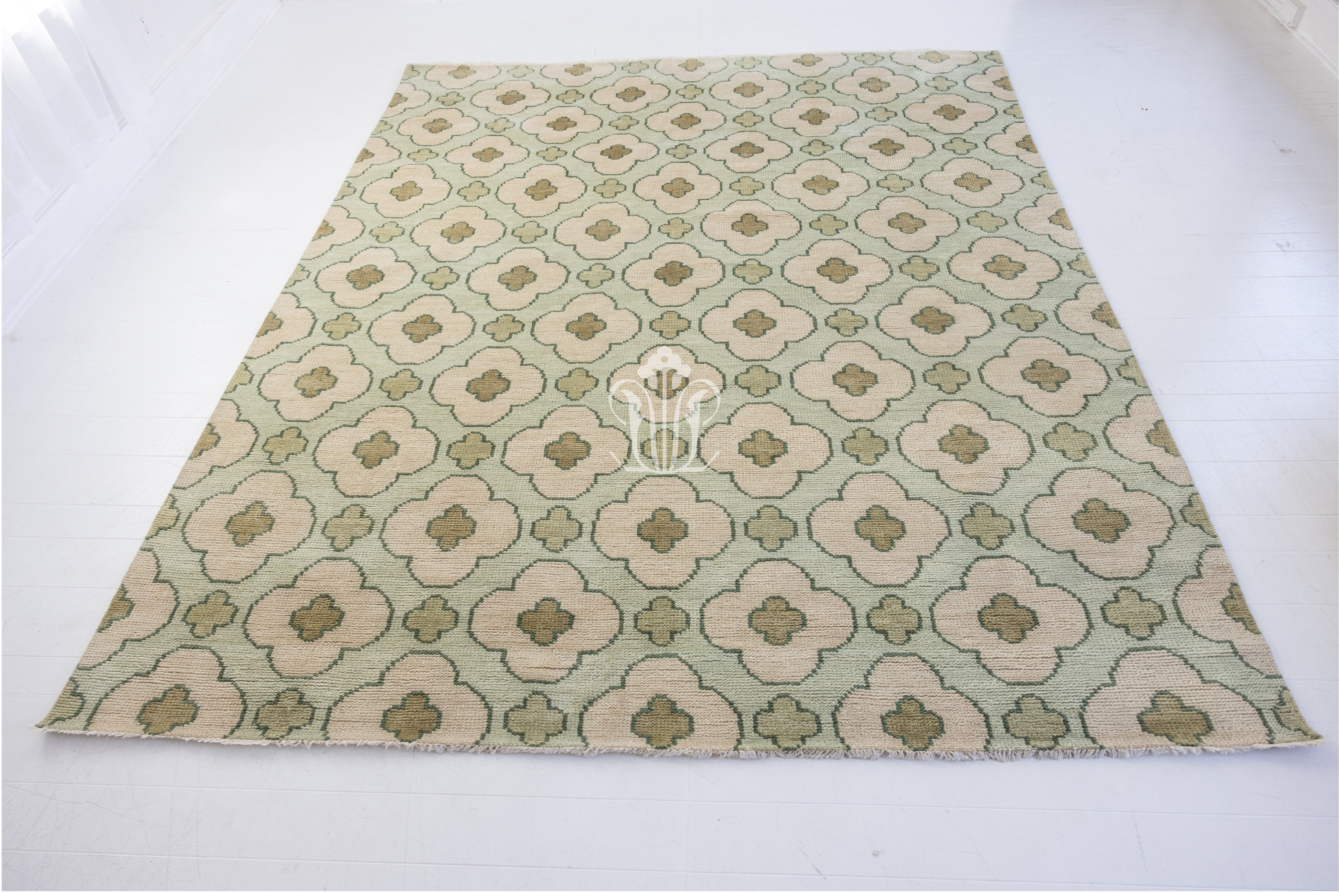 Hand-knotted wool rug featuring geometric patterning in warm taupe, clay, and ivory tones. The Cricket Rug from Locust Lane blends earthy color and artisan texture for a timeless, collected look.