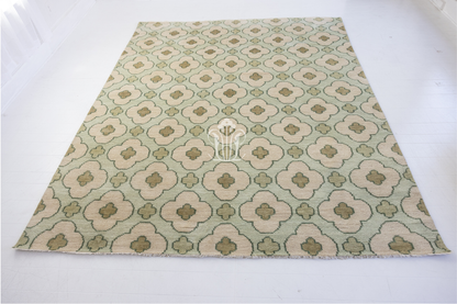 Hand-knotted wool rug featuring geometric patterning in warm taupe, clay, and ivory tones. The Cricket Rug from Locust Lane blends earthy color and artisan texture for a timeless, collected look.