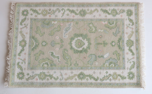 Hand-knotted wool rug with classic Oushak floral design in soft green, ivory, and blush – Ellis Mini Rug by Locust Lane Rugs