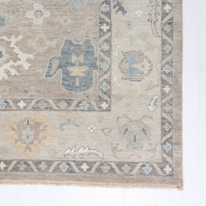 soft tones of beige, blue and grey hand knotted rug