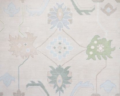 Fiona hand-knotted wool Oushak rug in ivory and faded blue from Locust Lane Rugs.