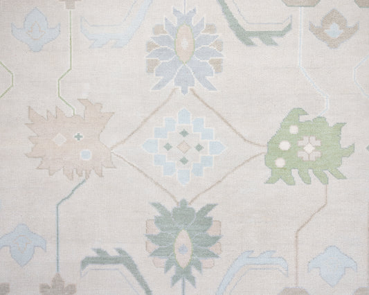 Fiona hand-knotted wool Oushak rug in ivory and faded blue from Locust Lane Rugs.