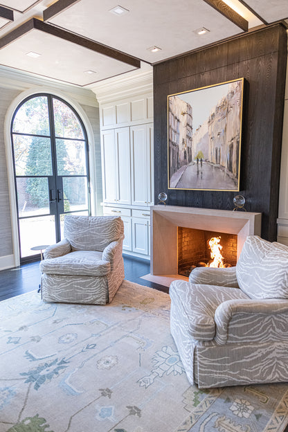 Fiona hand-knotted wool Oushak rug in ivory and faded blue from Locust Lane Rugs in a living room.