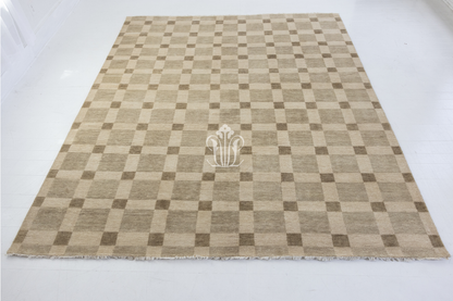 Checkered rug with a central logo on a white background