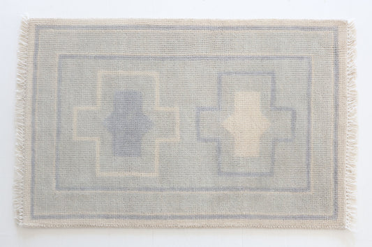 Hand-knotted wool rug with geometric cross design in soft blue and cream – Loretta Mini Rug by Locust Lane Rugs
