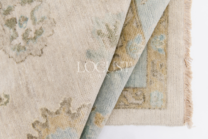 neutral and blue handknotted rug