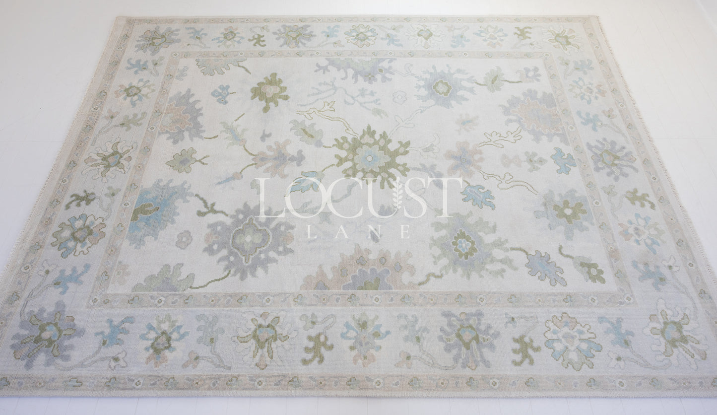 Opal hand-knotted wool rug in soft blue, blush, olive, and ivory from Locust Lane Rugs