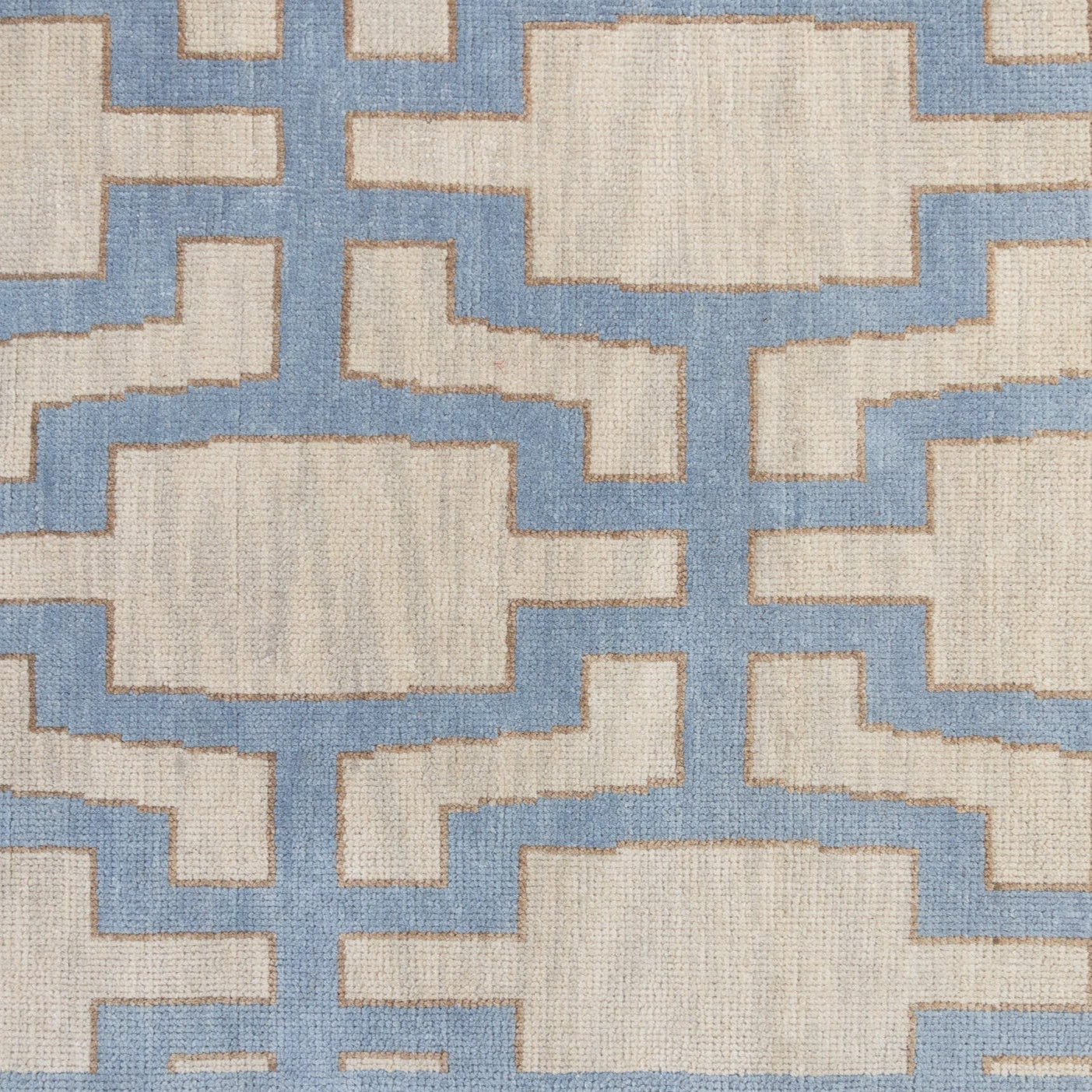 Della hand-knotted wool rug in blue, ivory, and chartreuse from Locust Lane Rugs.