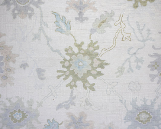 Opal hand-knotted wool rug in soft blue, blush, olive, and ivory from Locust Lane Rugs