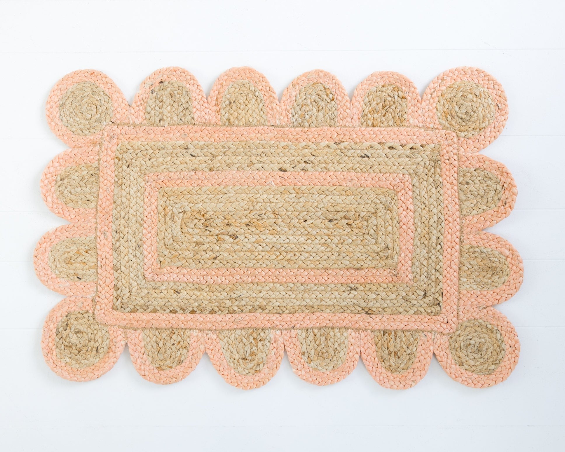 Hand-braided natural jute rug with scalloped border in soft peach – Peach Scalloped Jute Mini Rug by Locust Lane Rugs