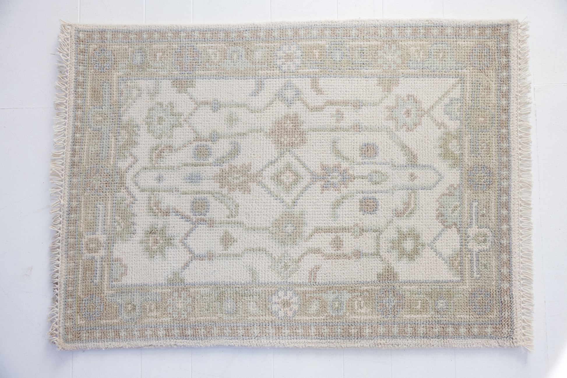 Hand-knotted wool rug with classic Oushak pattern in ivory, sky blue, and taupe – Pearl Mini Rug by Locust Lane Rugs