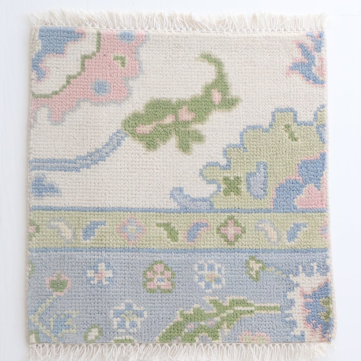 Hand-knotted Oushak rug sample in blue, green, and blush wool – Riley Jane Rug Sample by Locust Lane Rugs