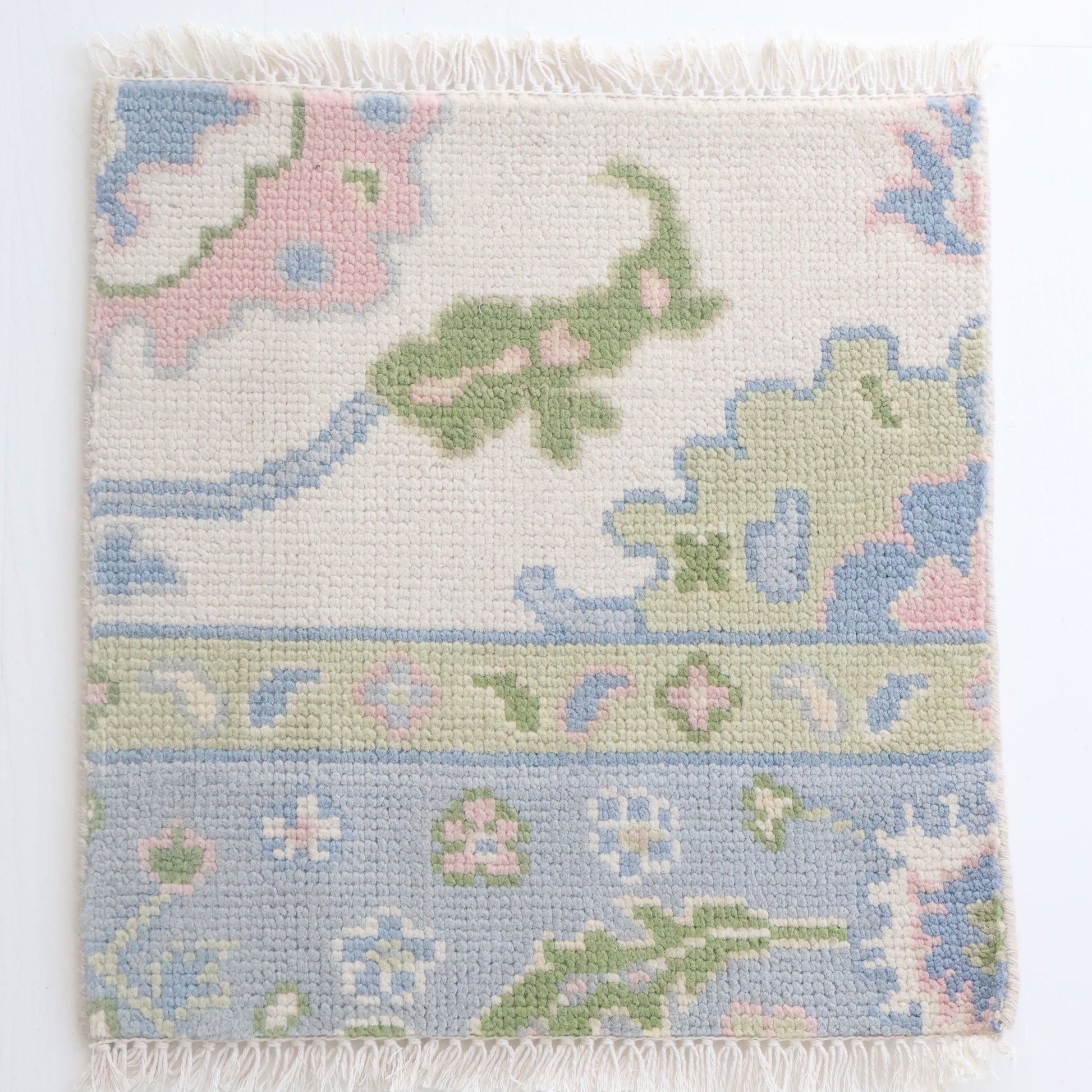 Hand-knotted Oushak rug sample in blue, green, and blush wool – Riley Jane Rug Sample by Locust Lane Rugs