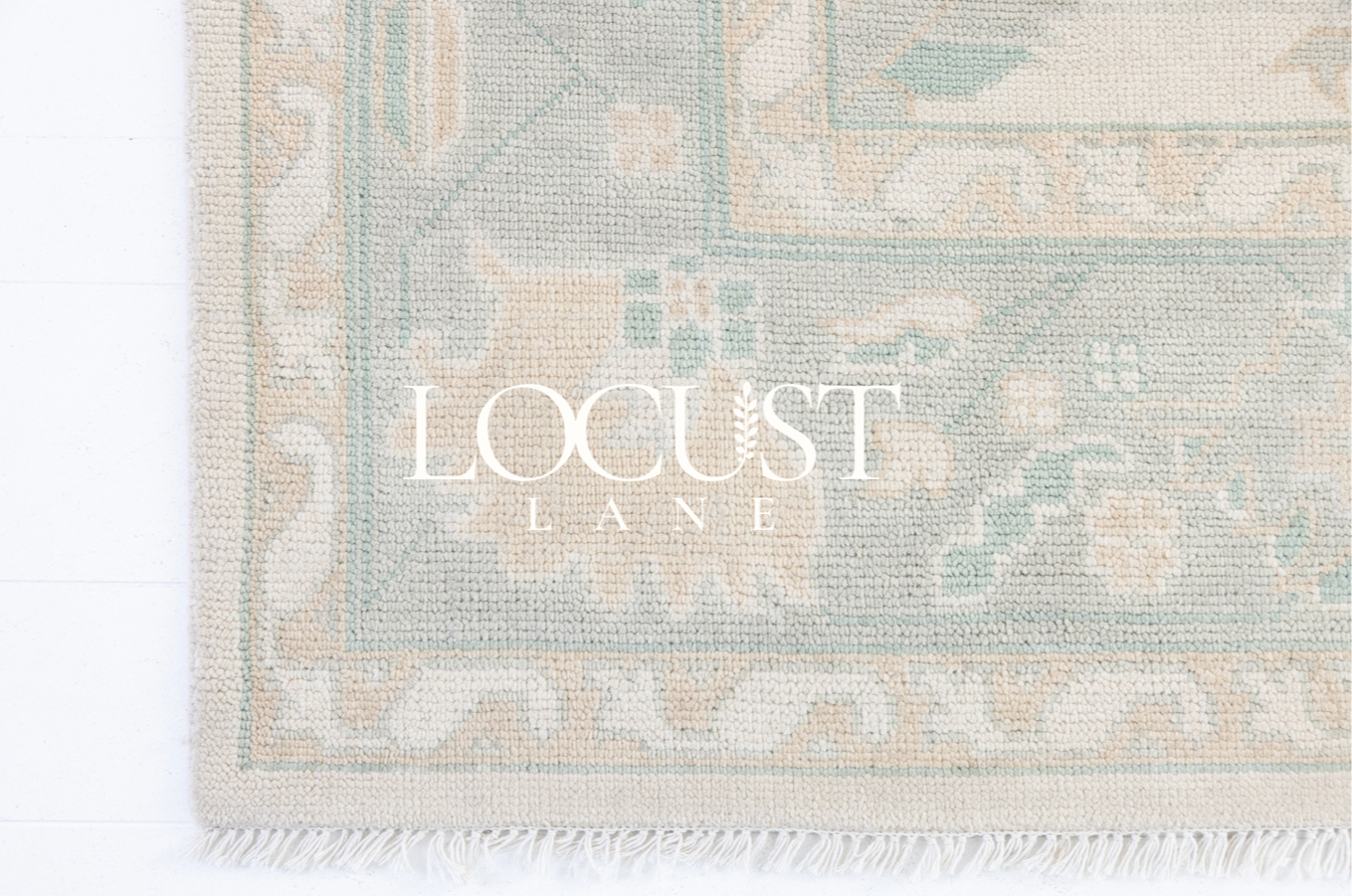 Hand-knotted wool rug in ivory with soft seafoam and sand Oushak motifs – Weezie Modern Oushak Rug by Locust Lane Rugs